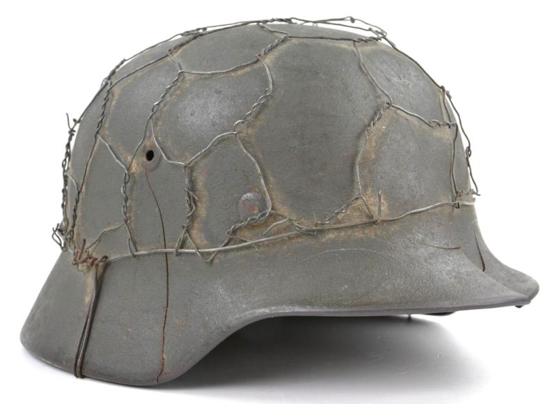 German WH M40 SD Combat Helmet with Battle damage and Half Wire Basket