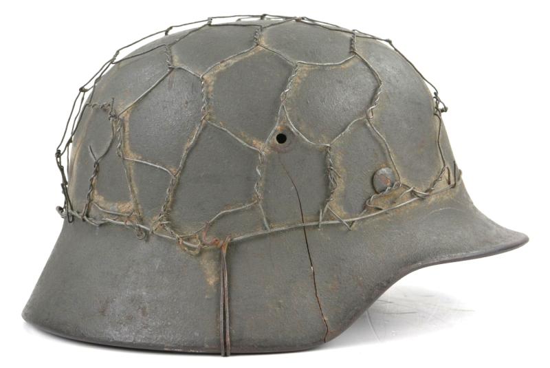 German WH M40 SD Combat Helmet with Battle damage and Half Wire Basket